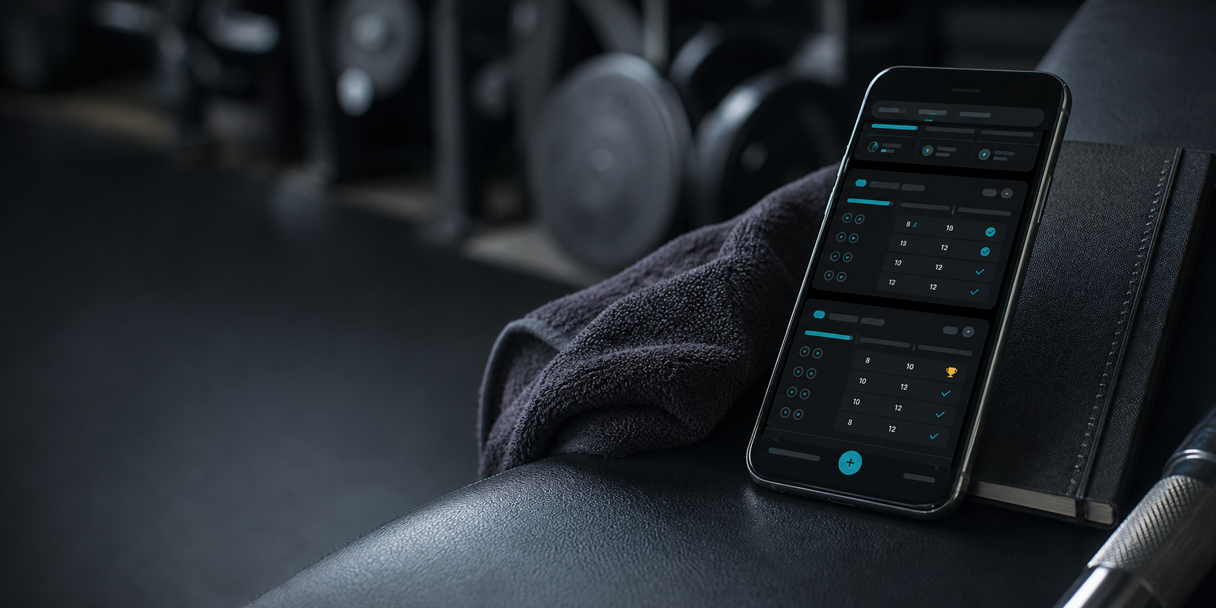 A phone showing a dark workout log interface on a gym bench.
